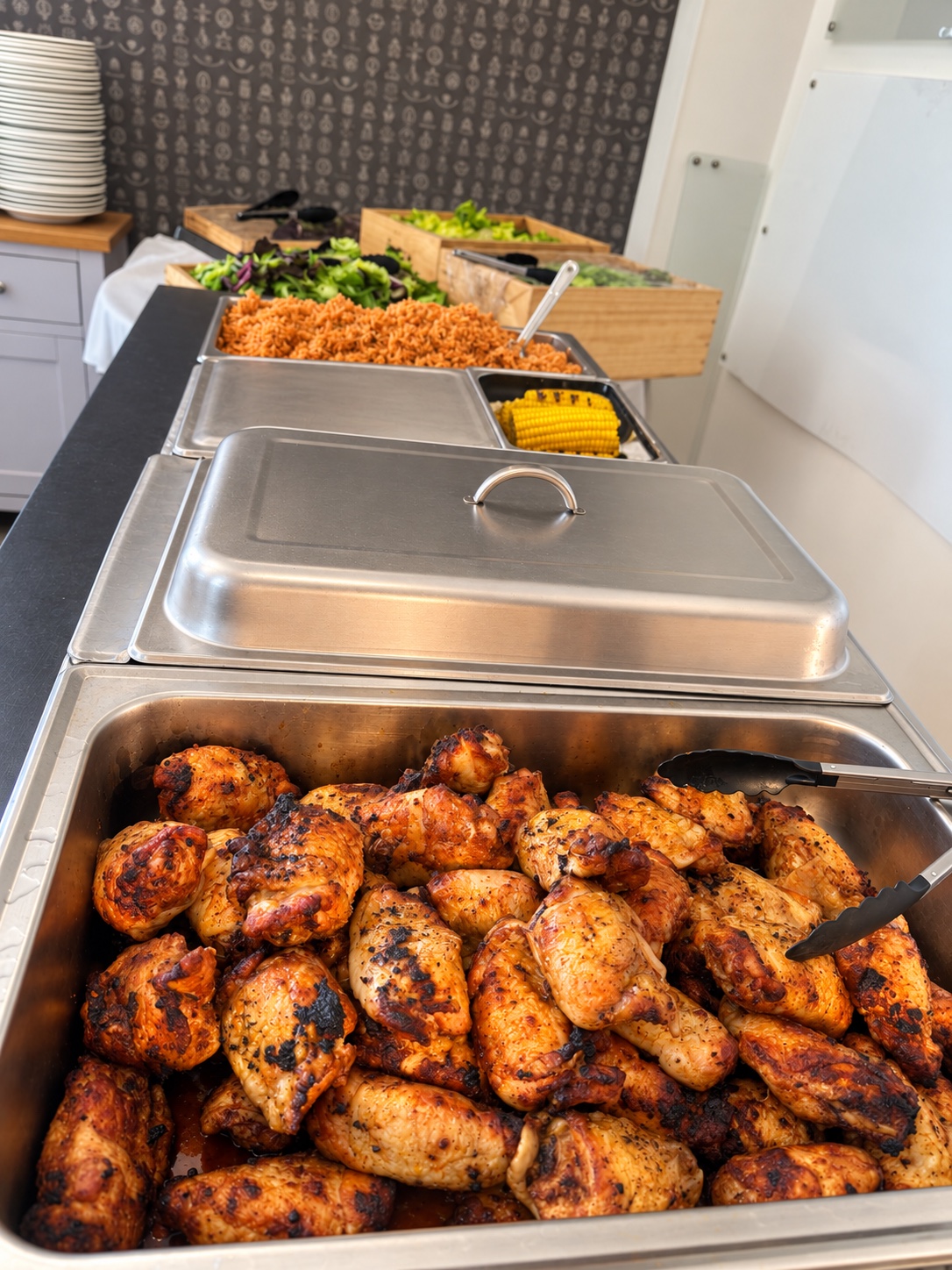 Freshly grilled chicken prepared for buffet service
